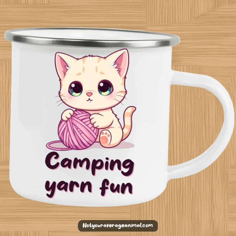 Funny camping mug featuring a cute cat with wide eyes, batting at a ball of yarn, perfect for cozy outdoor moments.