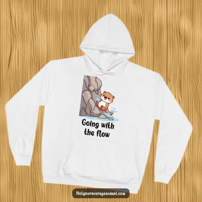 Funny hoodie: A playful otter slides down a rocky slope, resulting in a big, joyous splash.