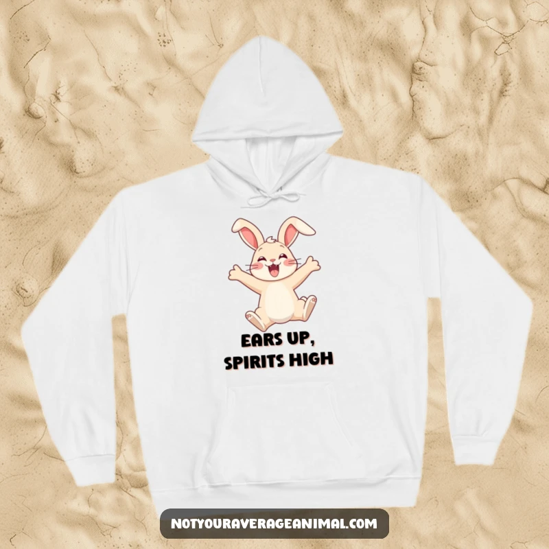 Funny hoodie featuring a delighted bunny in mid-leap, ears dramatically flopped, embodying cozy comfort and unrestrained happiness.