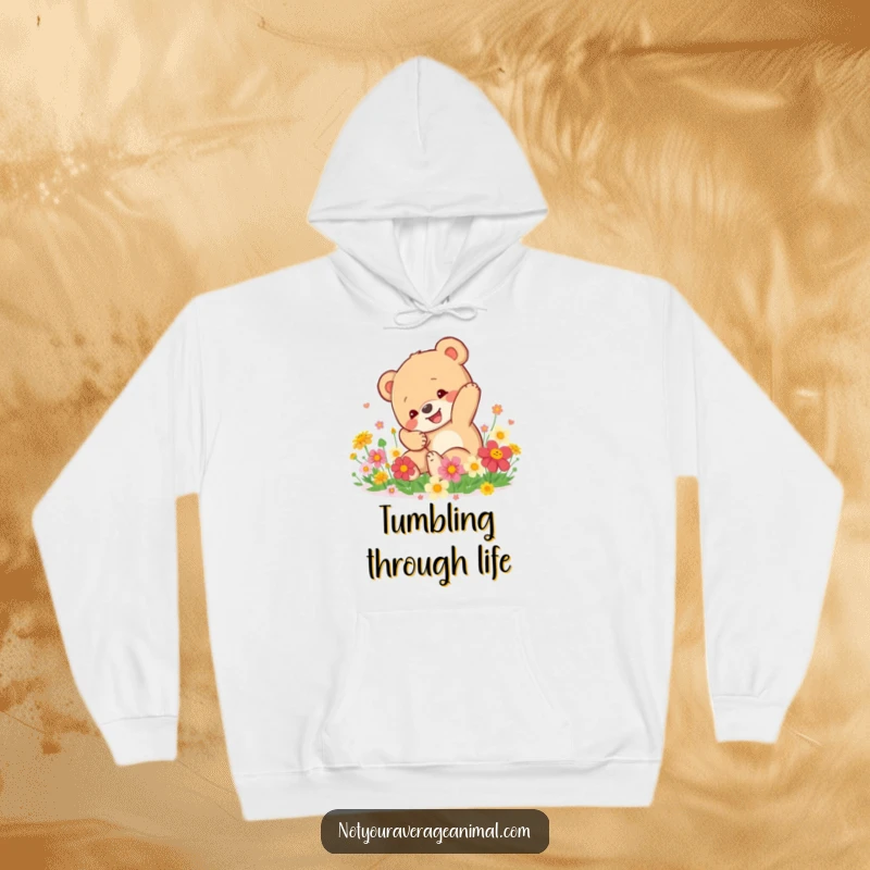 Funny Bear Cub Hoodie: A happy bear cub tumbles in a patch of colorful flowers, providing cozy comfort and cheer.