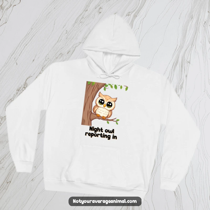 Funny hoodie featuring a curious owl with large, observant eyes peeking from a tree, offering warmth and a touch of witty wisdom.
