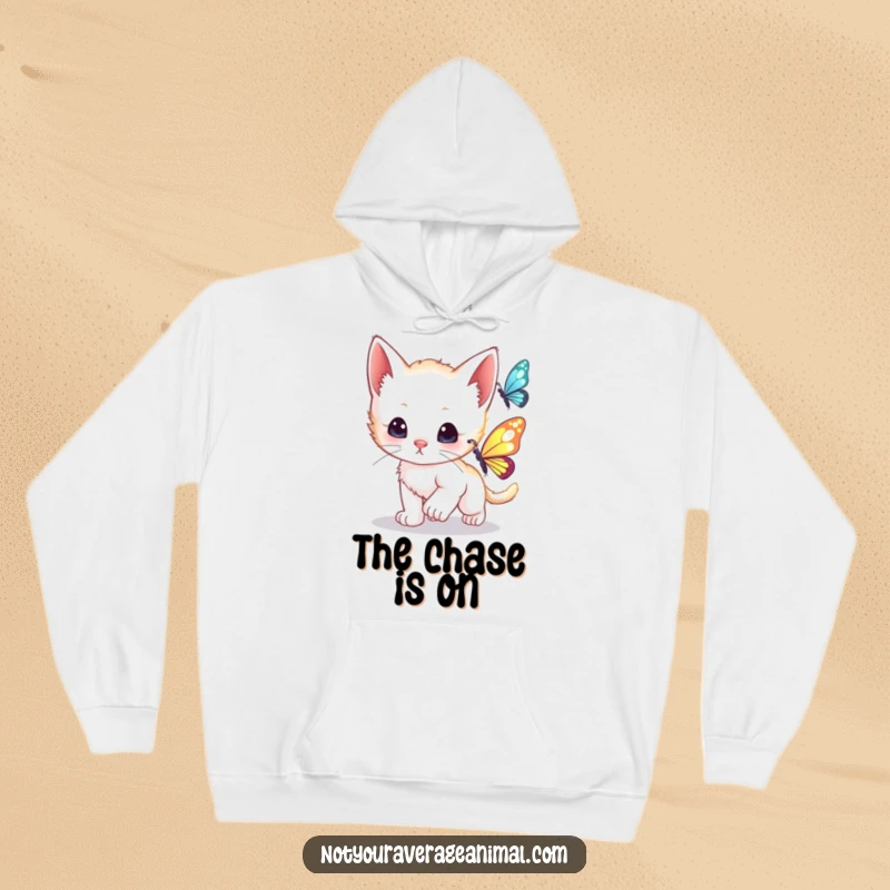 Funny curious kitten mid-chase after a shimmering butterfly, featured on a cozy and fun hoodie.
