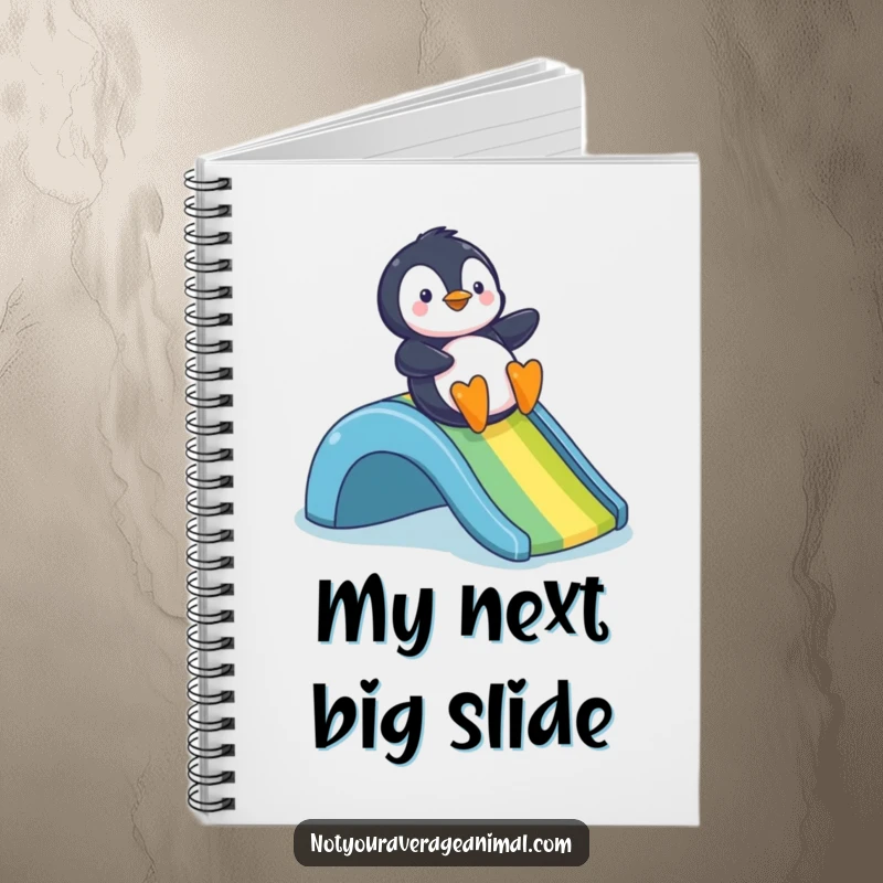 Funny notebook cover with a cheerful penguin sliding down a vibrant rainbow, perfect for jotting down joyful thoughts.