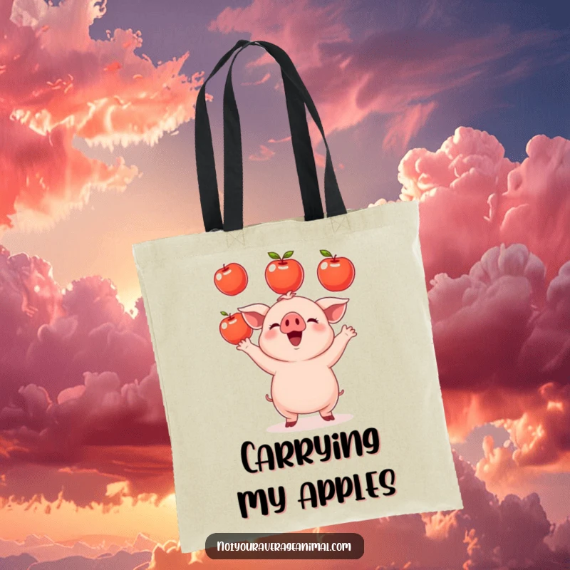 Funny small round piglet tote bag depicting a happy piglet juggling shiny apples. A charming and useful farm-themed gift.