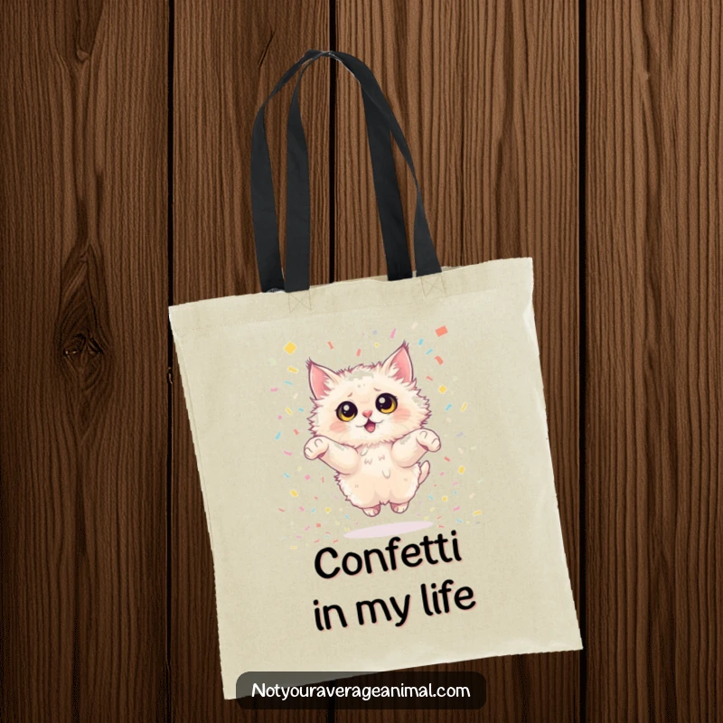 Funny fluffy cat tote bag showing a cat with huge eyes mid-air in a joyful confetti leap. A stylish and humorous accessory.